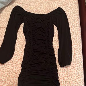 Black, ruffled off the shoulder dress with stretchy material.